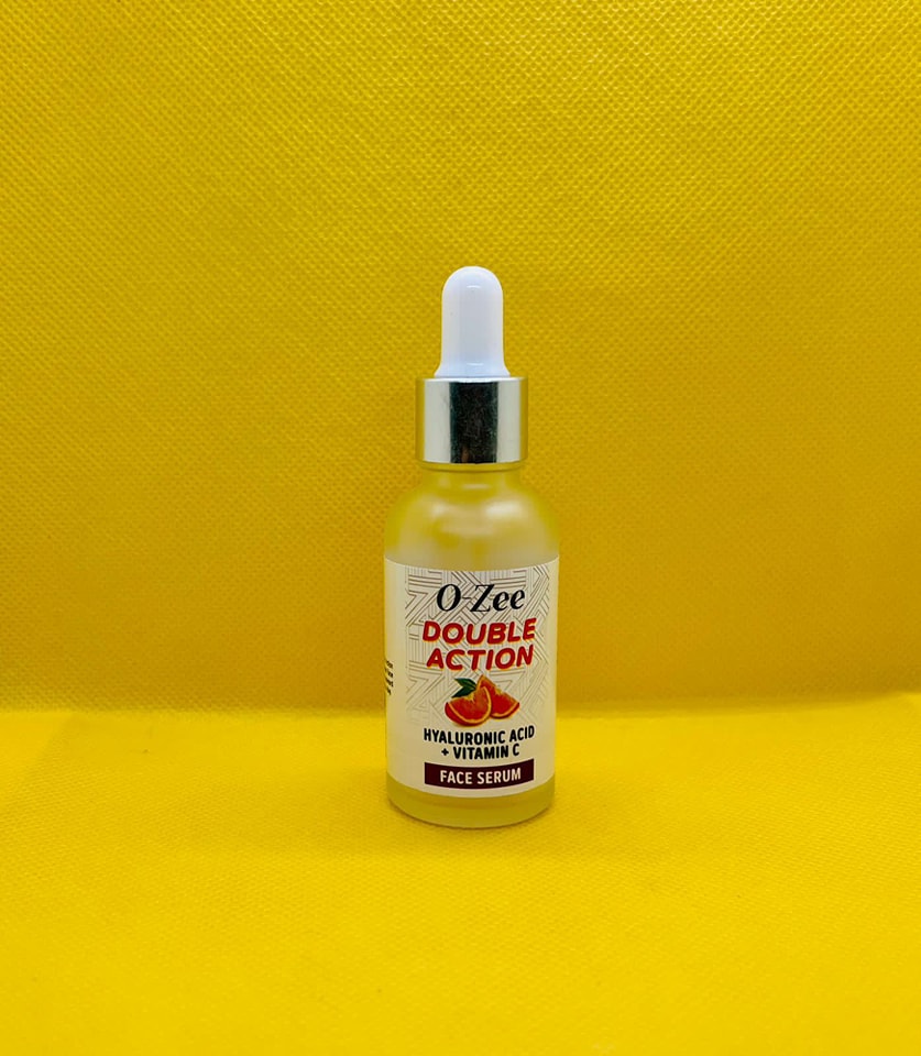 Model applying O-Zee Face Serum for daily skincare